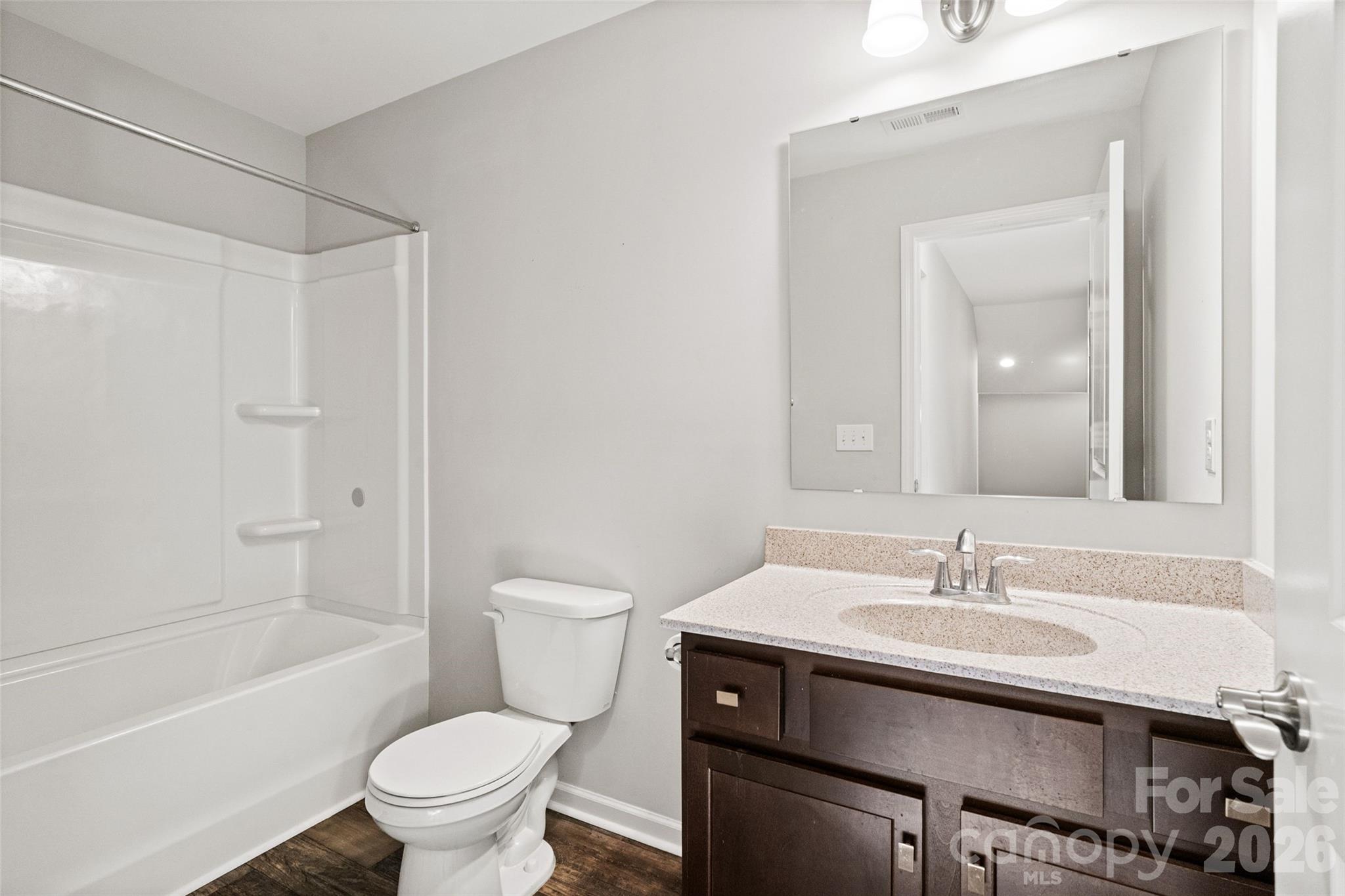 21260 Sanctuary Drive Lancaster, SC 29720 - Photo 30 of 44 a bathroom with a sink toilet vanity and shower