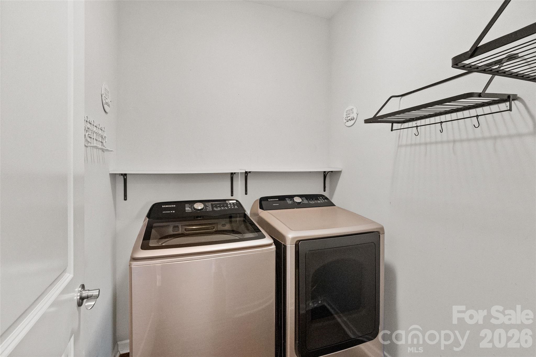 21260 Sanctuary Drive Lancaster, SC 29720 - Photo 36 of 44 a utility room with dryer washer and empty racks