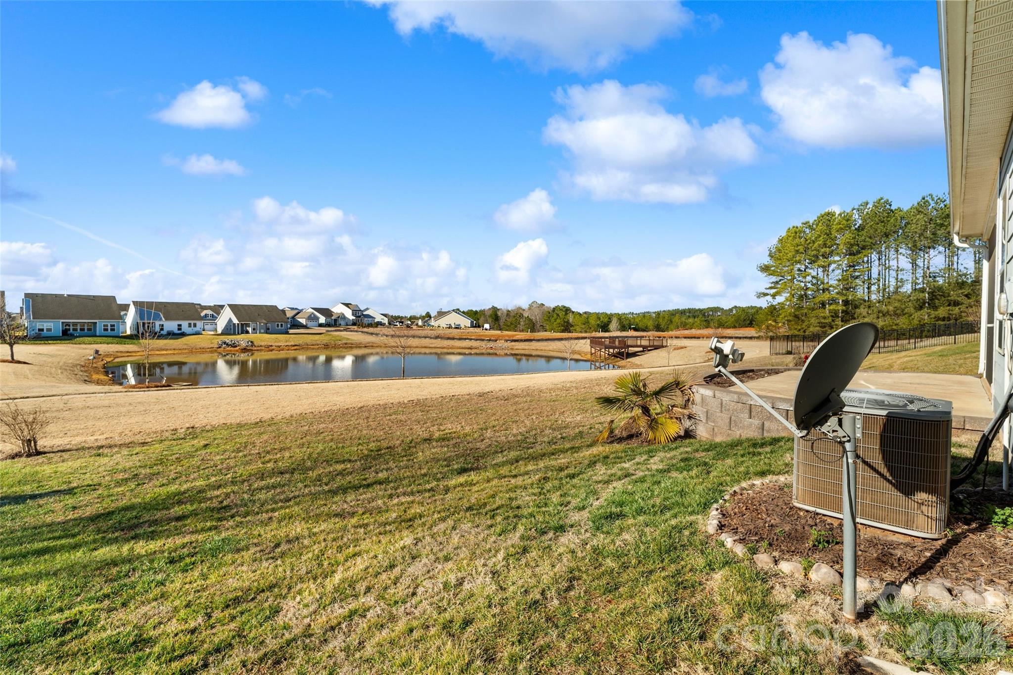 21260 Sanctuary Drive Lancaster, SC 29720 - Photo 38 of 44 a view of a lake with houses in the back