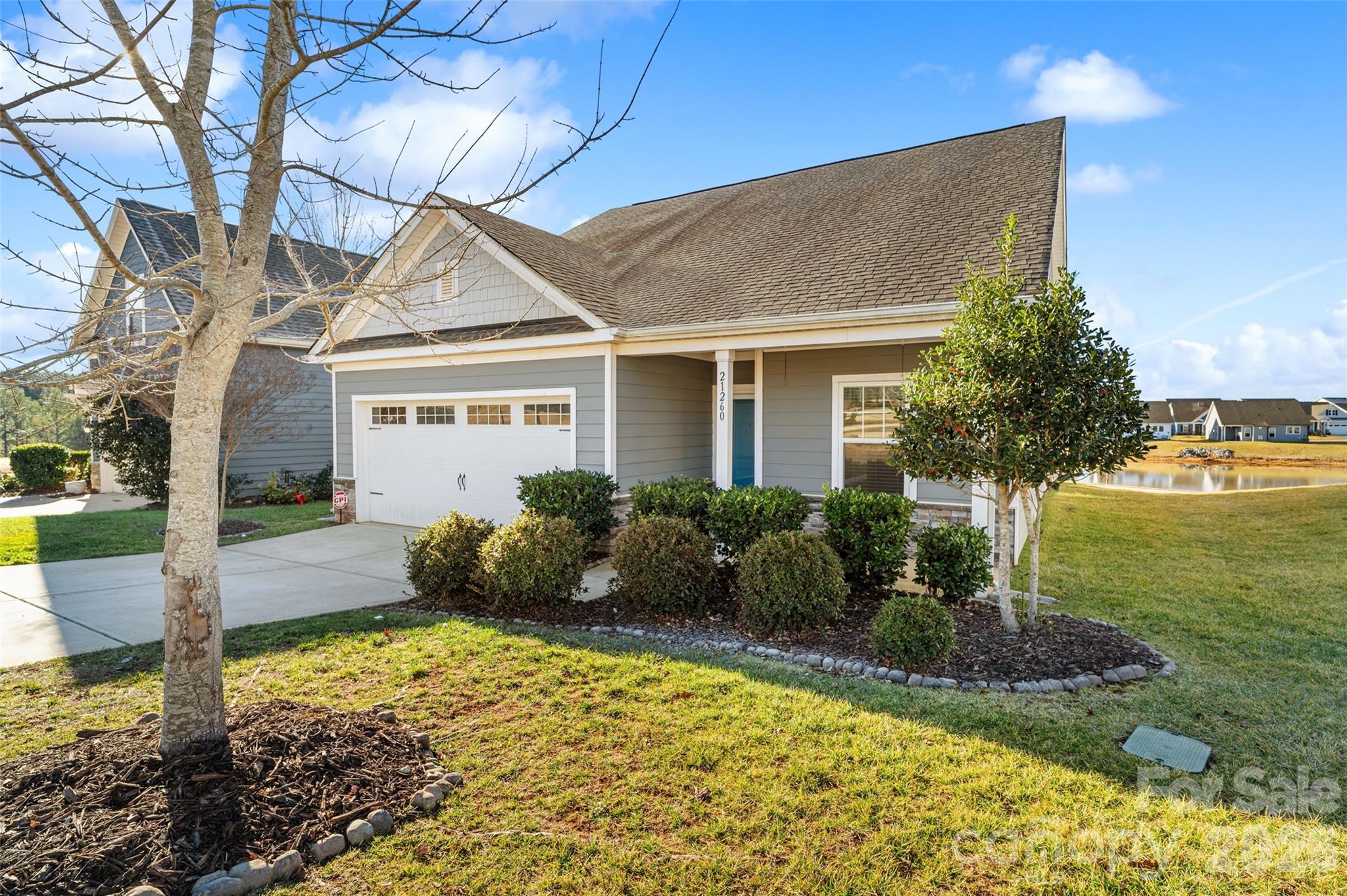 21260 Sanctuary Drive Lancaster, SC 29720 - Photo 4 of 44 a front view of a house with garden
