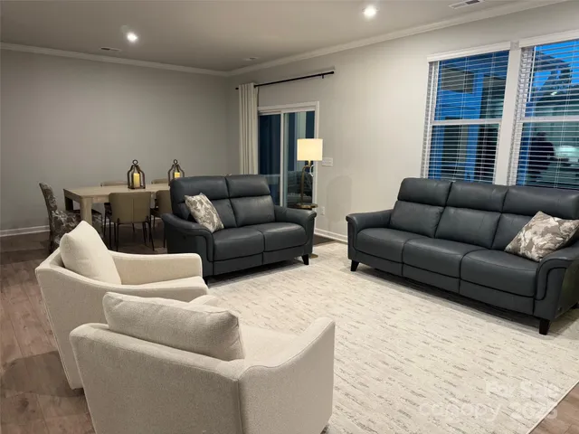 a living room with furniture window and a couch