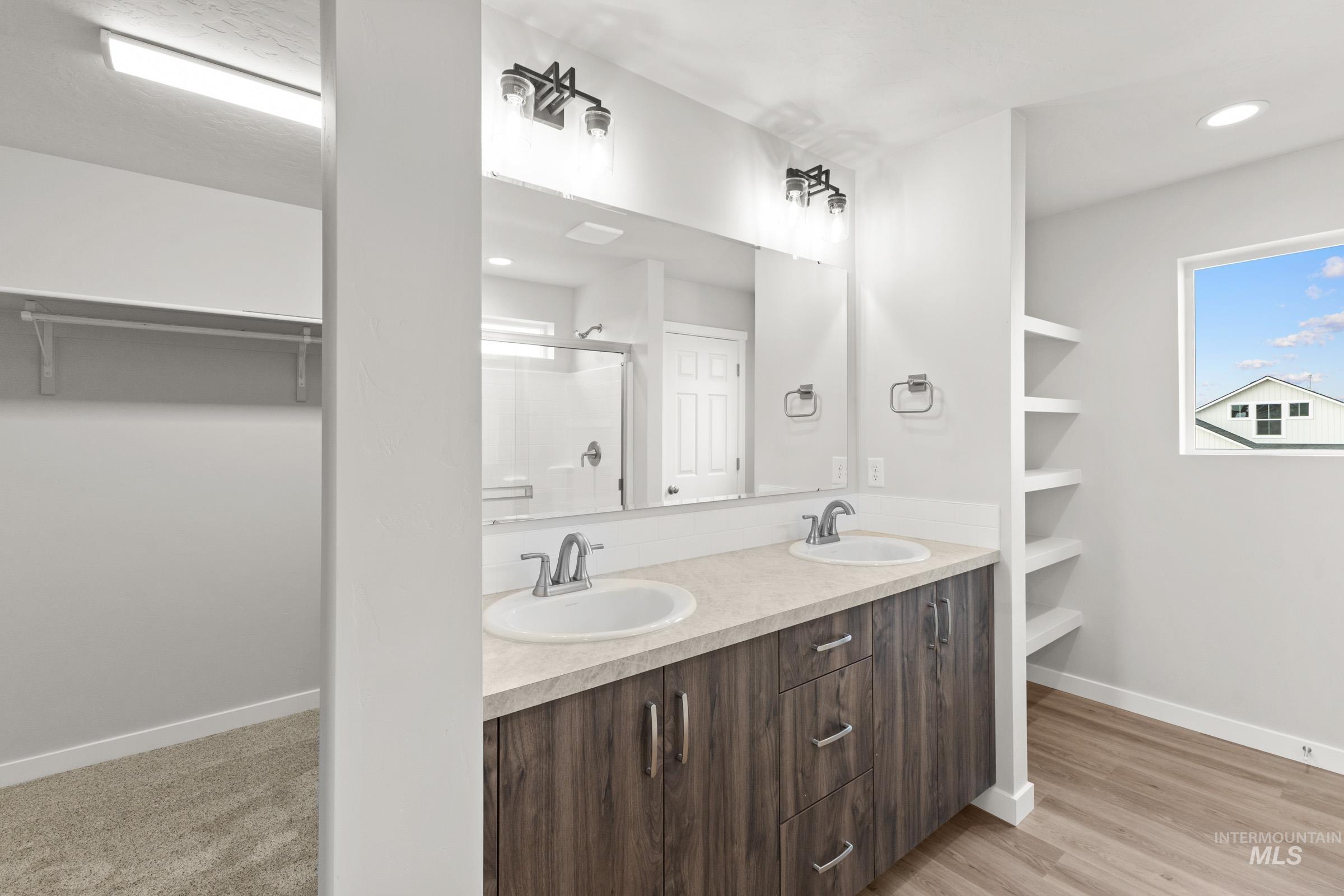461 Waverly Avenue Middleton, ID 83644 - Photo 19 of 22 Full bath with a spacious closet, a shower stall, double vanity, recessed lighting, and light wood-type flooring