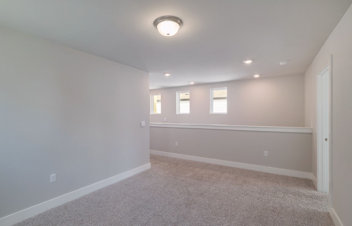 7607 Eckington Street, Unit 235 Austin, TX 78744 - Photo 15 of 37 a view of empty room with windows