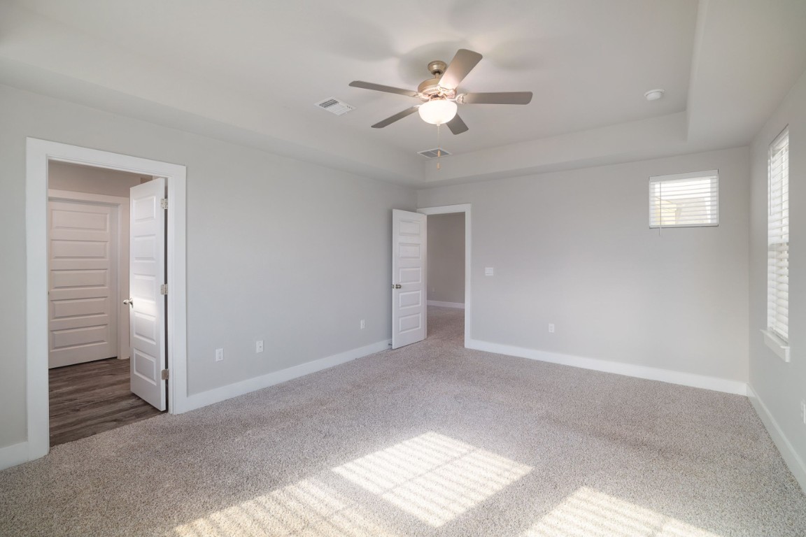 7607 Eckington Street, Unit 235 Austin, TX 78744 - Photo 17 of 37 a view of an empty room with chandelier fan