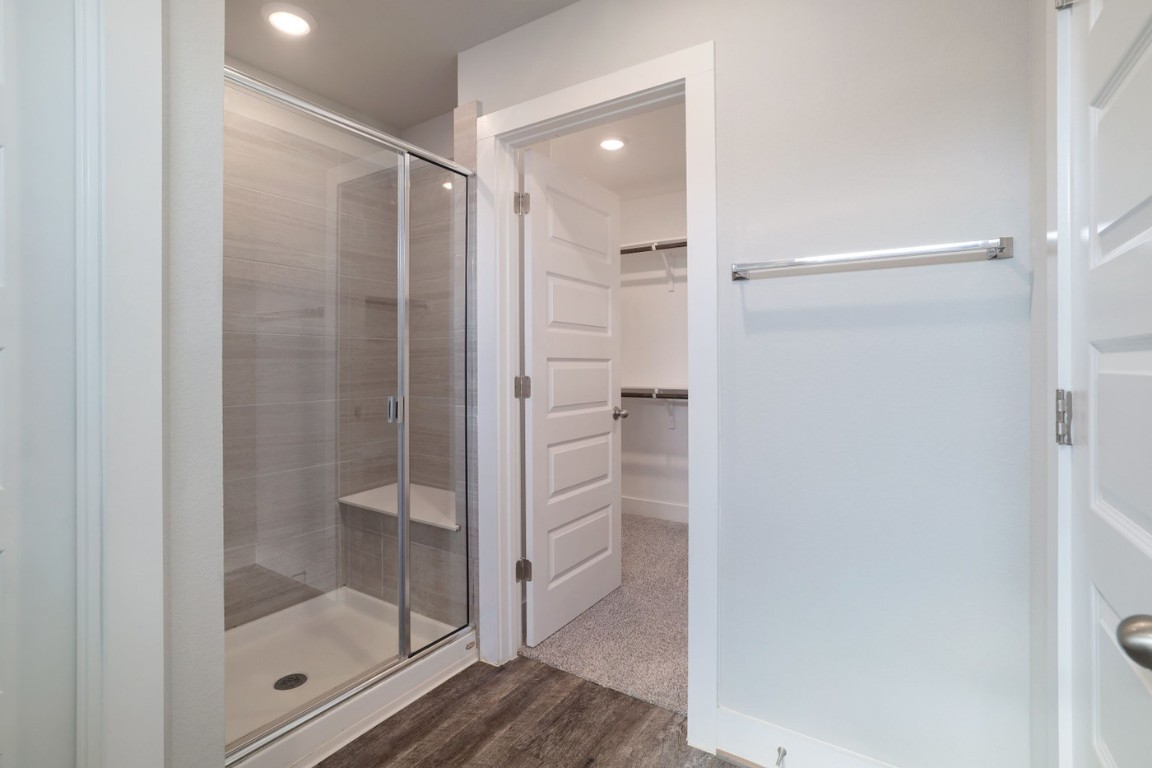 7607 Eckington Street, Unit 235 Austin, TX 78744 - Photo 19 of 37 a bathroom with a glass shower door