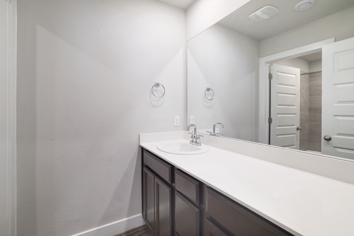 7607 Eckington Street, Unit 235 Austin, TX 78744 - Photo 23 of 37 a bathroom with a sink and a mirror