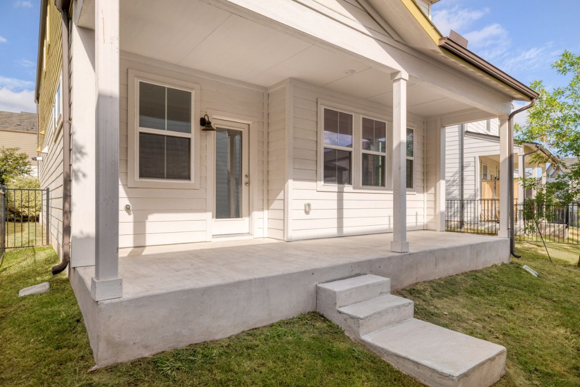 7607 Eckington Street, Unit 235 Austin, TX 78744 - Photo 26 of 37 front view of a house with a yard