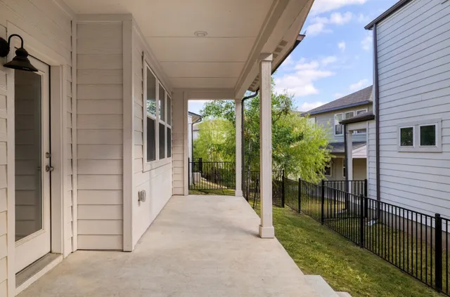 a view of a porch with wooden floor and outdoor space