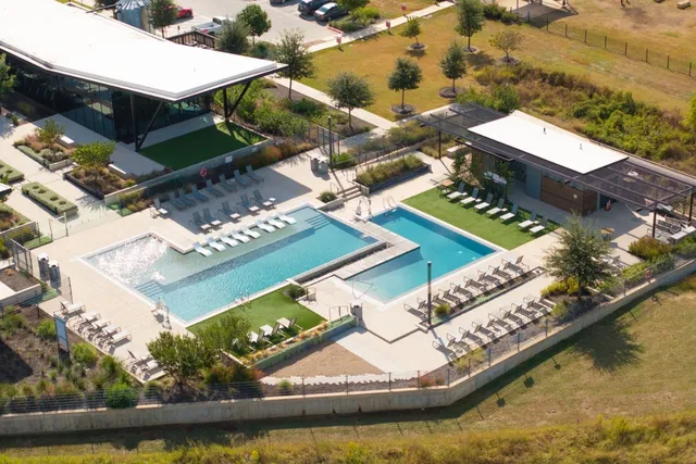 an aerial view of a house with a swimming pool