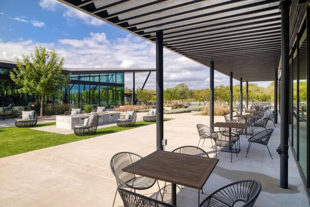 a living room with lots of furniture and a chandelier