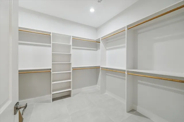 a view of an empty walk in closet