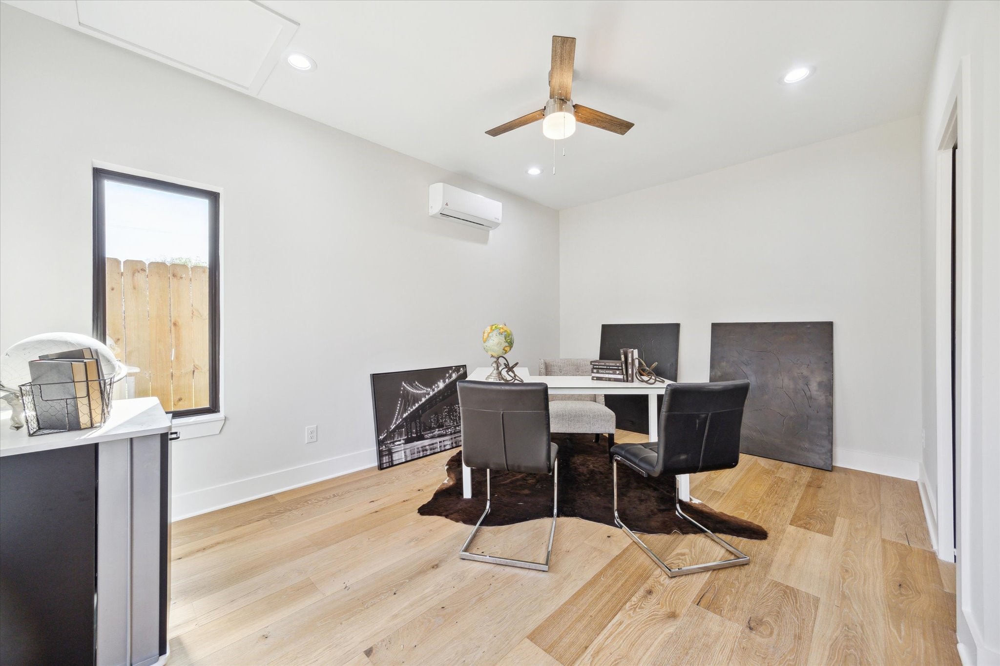 2207 Stevens Street Houston, TX 77026 - Photo 21 of 30 a view of a dining room with furniture and wooden floor