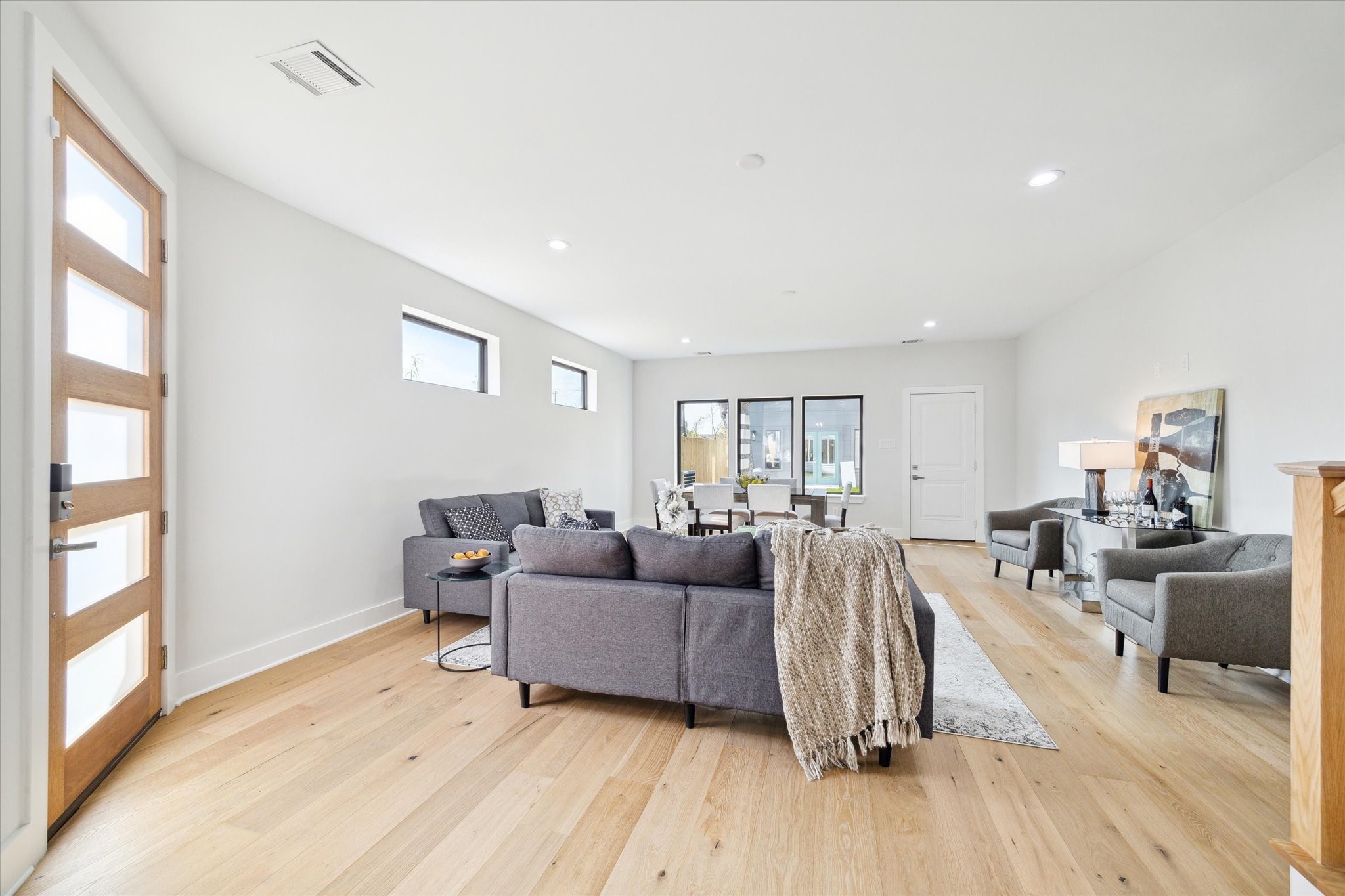 2207 Stevens Street Houston, TX 77026 - Photo 7 of 30 a living room with furniture and a wooden floor