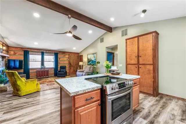 a view of room with wooden floor and closet