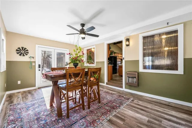 a spacious bedroom with a bed and a chandelier