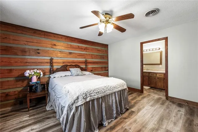 a bathroom with a sink a mirror and vanity