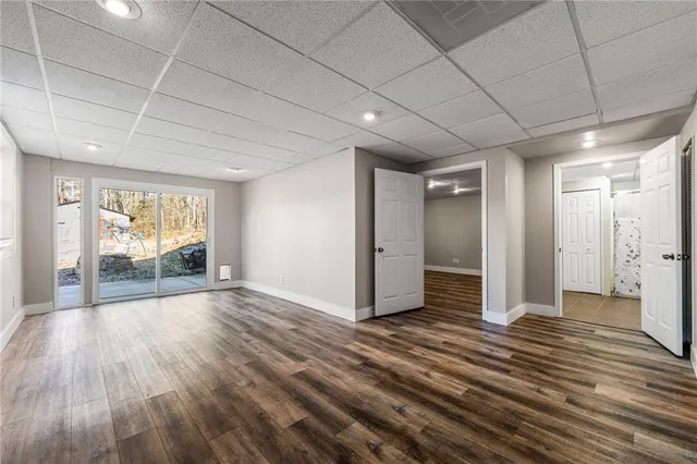 a view of a patio with a table chairs and a fire pit