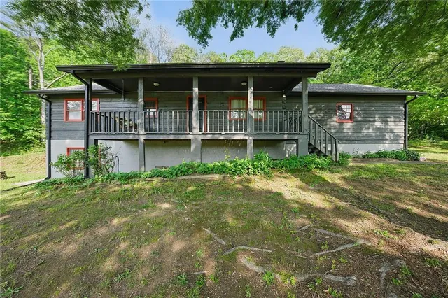 a view of a house with a yard and garage
