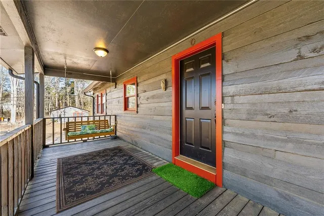 a view of a house with snow on the road