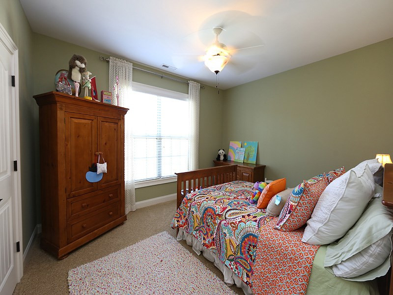 12913 Baybriar Drive Raleigh, NC 27613 - Photo 17 of 25 This bedroom also has a walk-in closet and fan. Guest room