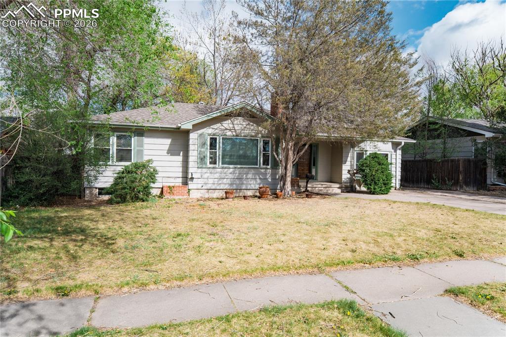 2818 Templeton Gap Road Colorado Springs, CO 80907 - Photo 27 of 27 a front view of a house with a yard and garage