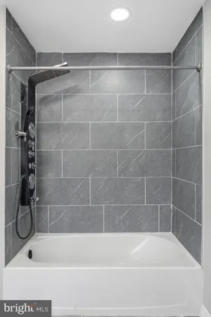 a bathroom with a shower and a bathtub