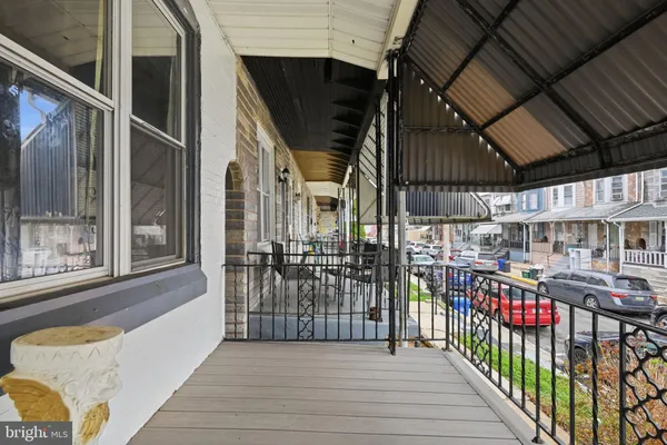 a view of a porch with wooden floor