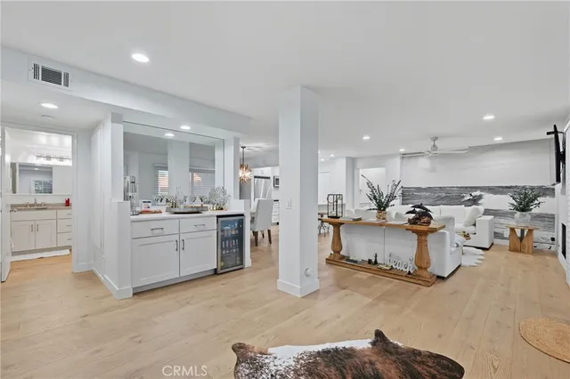 a large white kitchen with white cabinets and a stove