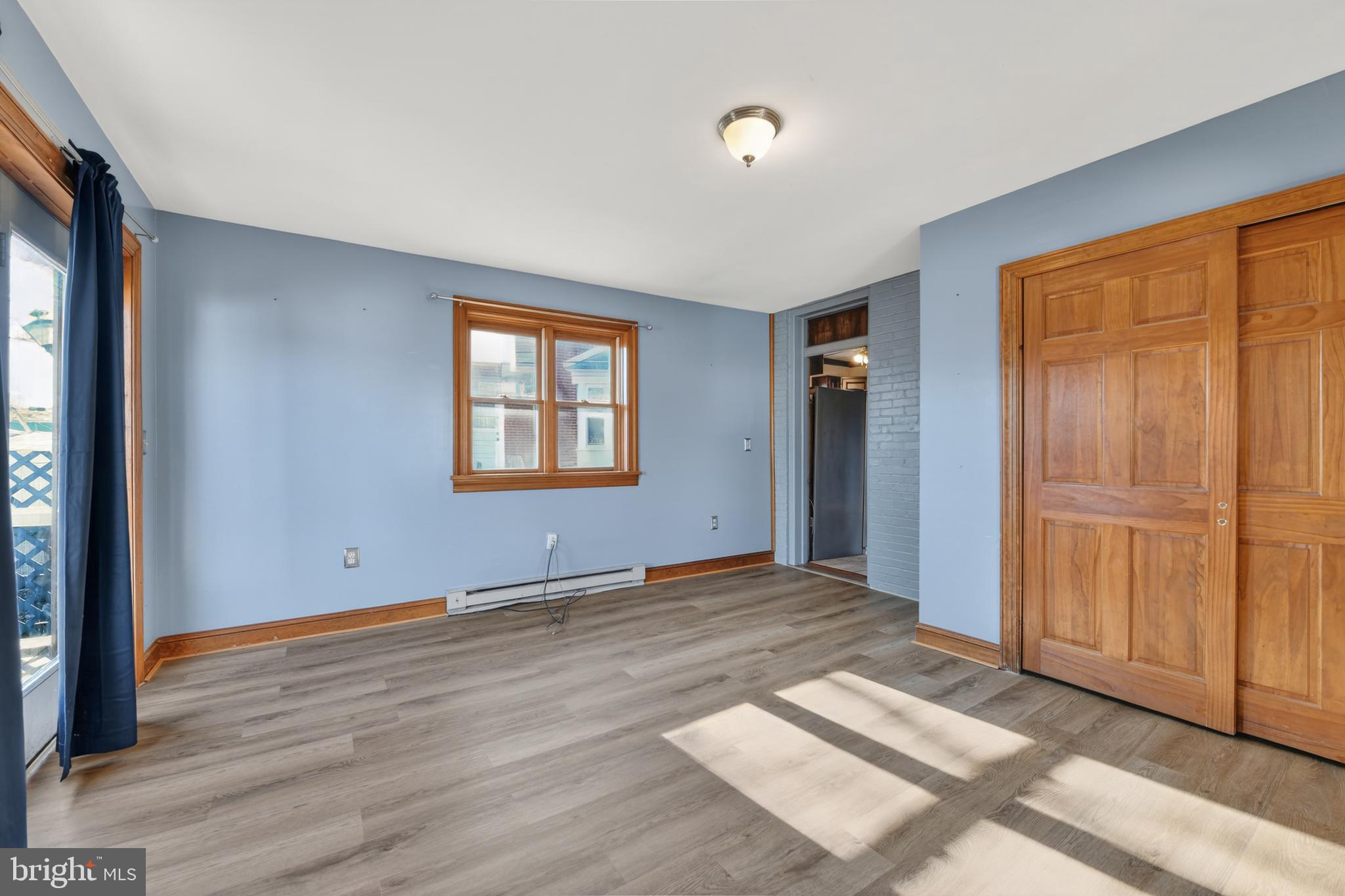 1378 Kenhorst Boulevard Reading, PA 19607 - Photo 15 of 29 a view of an empty room with wooden floor and a window
