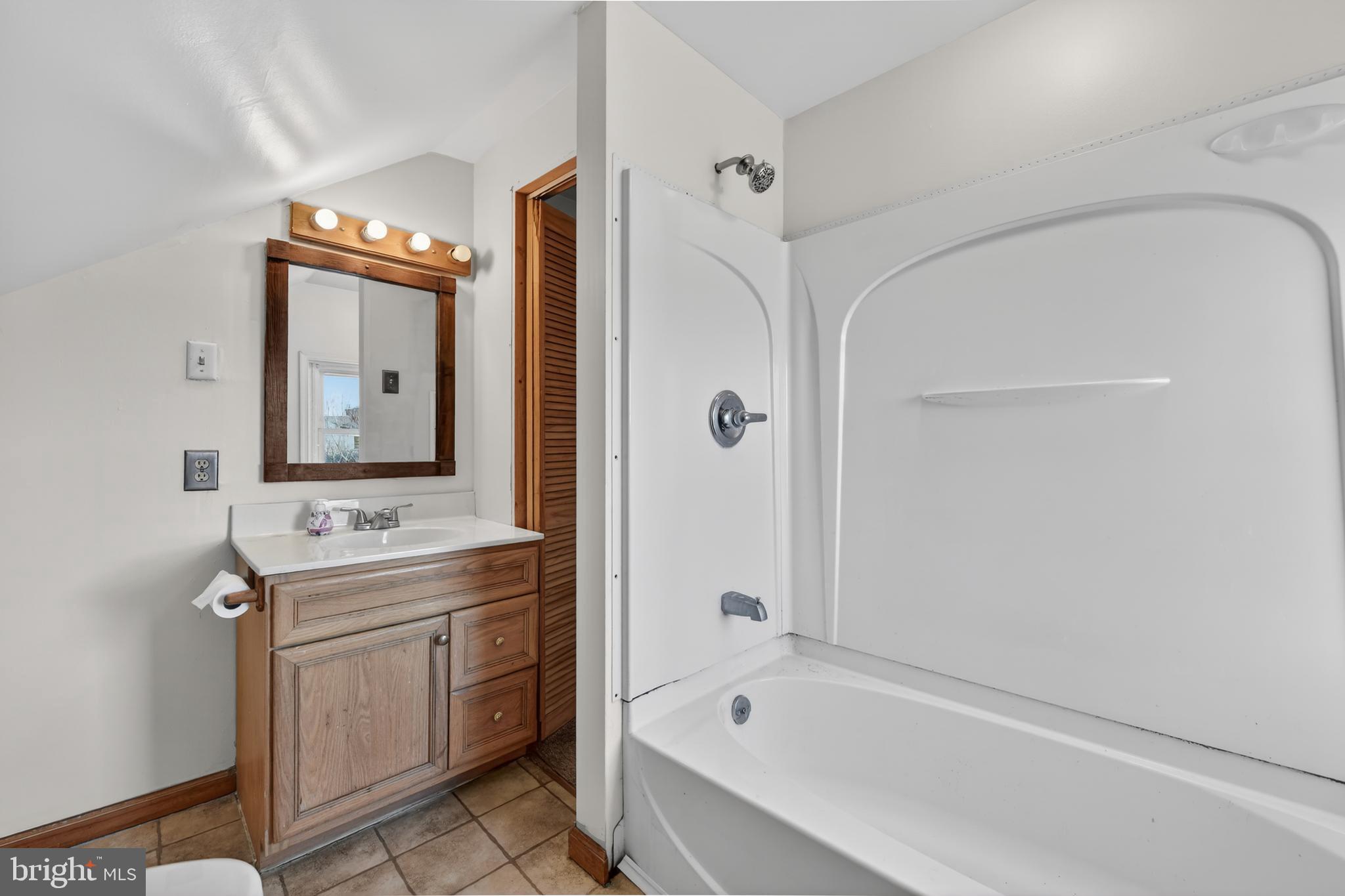 1378 Kenhorst Boulevard Reading, PA 19607 - Photo 22 of 29 a bathroom with a tub sink and mirror
