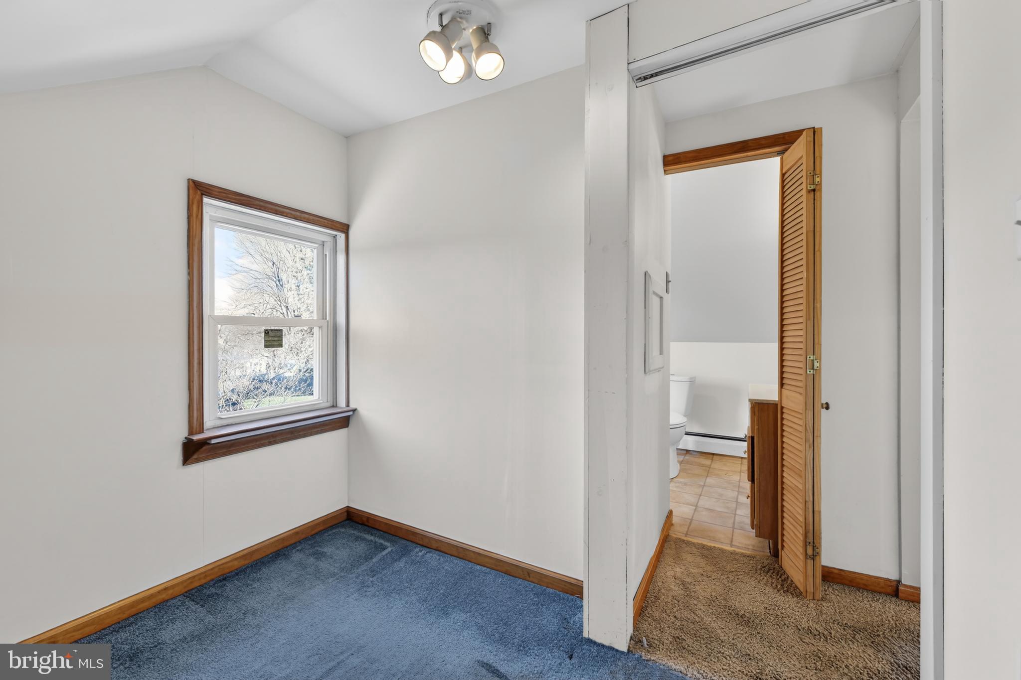 1378 Kenhorst Boulevard Reading, PA 19607 - Photo 23 of 29 a view of an empty room with wooden floor and a window