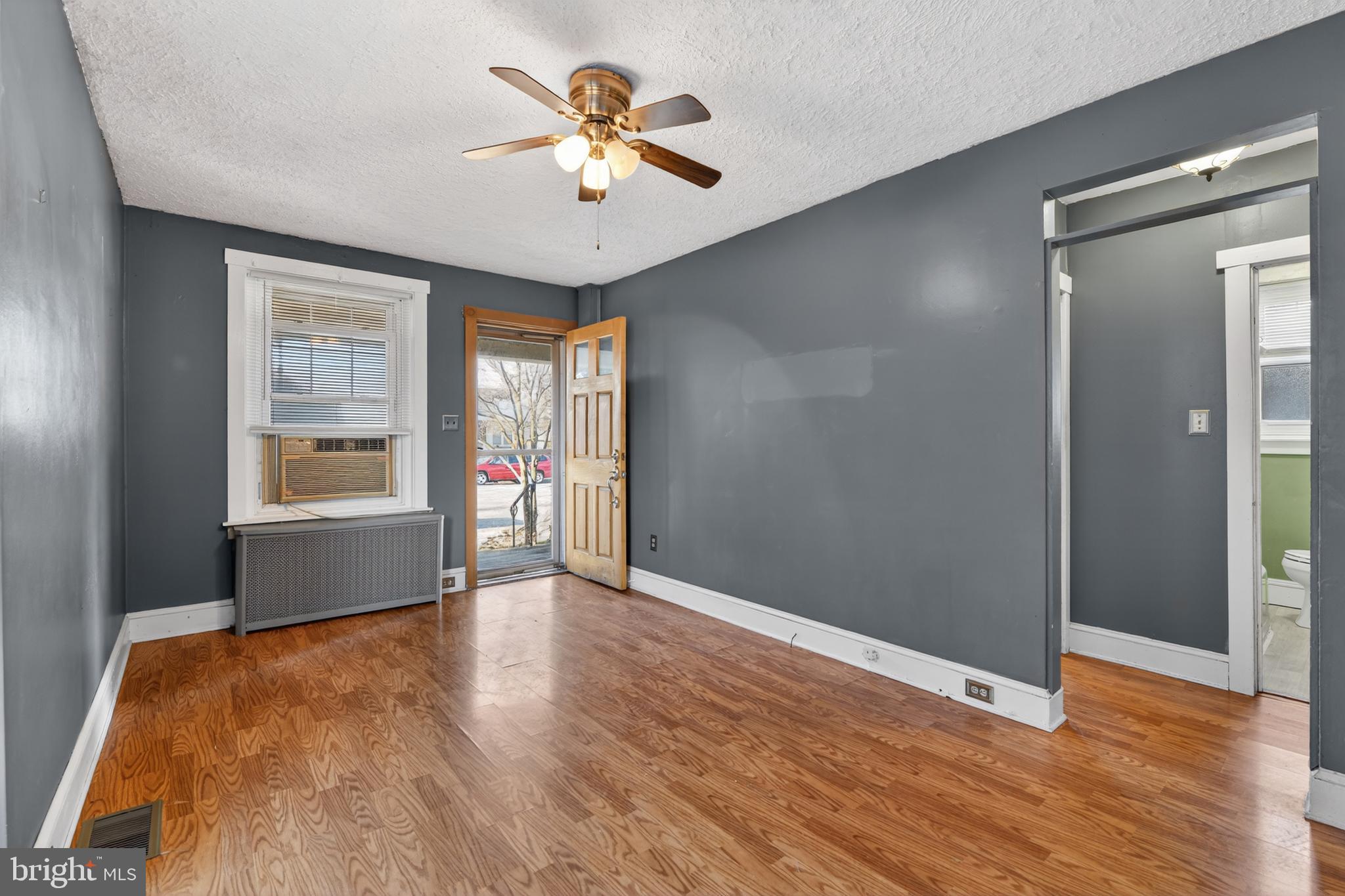 1378 Kenhorst Boulevard Reading, PA 19607 - Photo 5 of 29 an empty room with wooden floor and windows