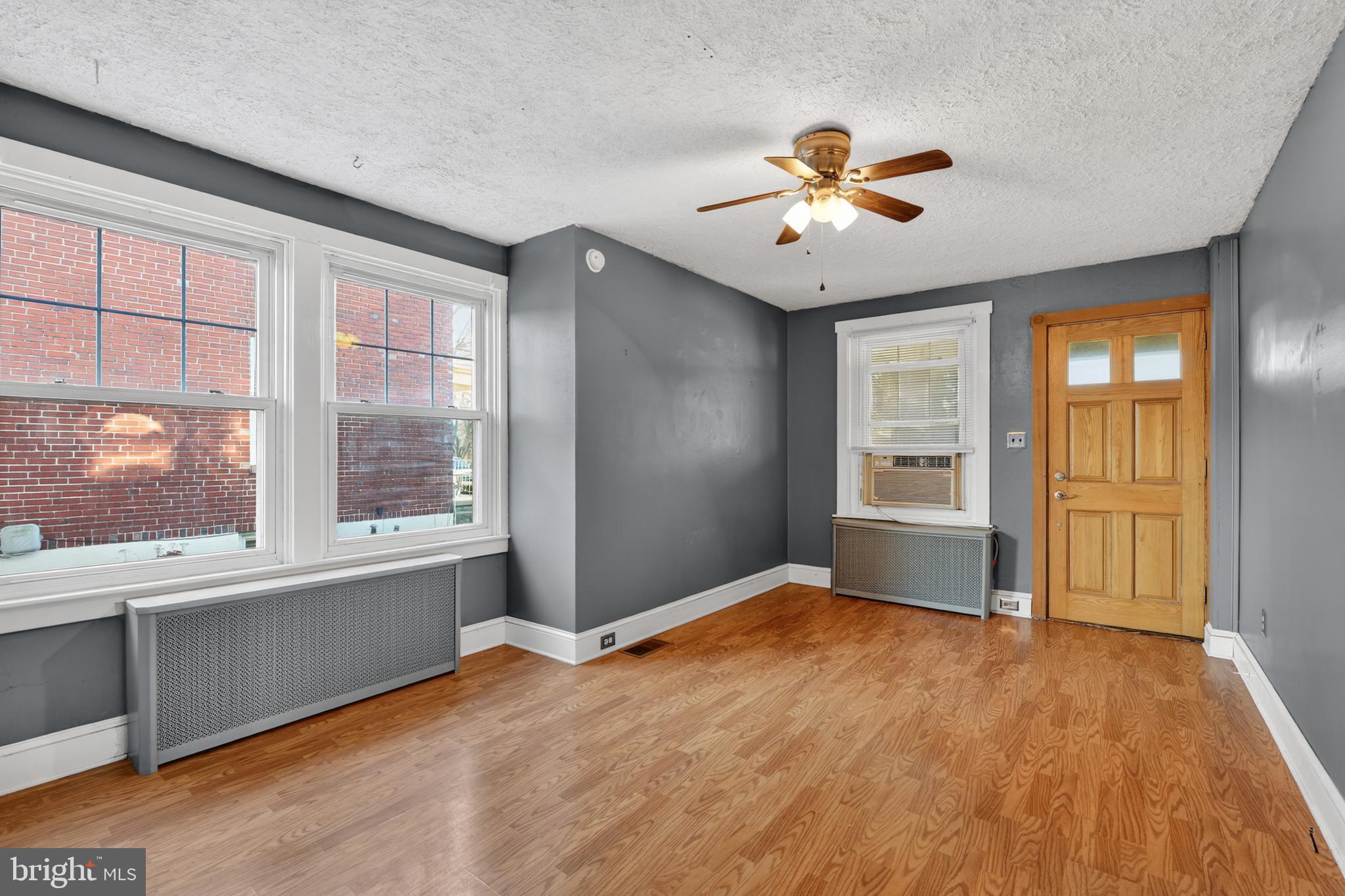 1378 Kenhorst Boulevard Reading, PA 19607 - Photo 6 of 29 wooden floor in an empty room with a window