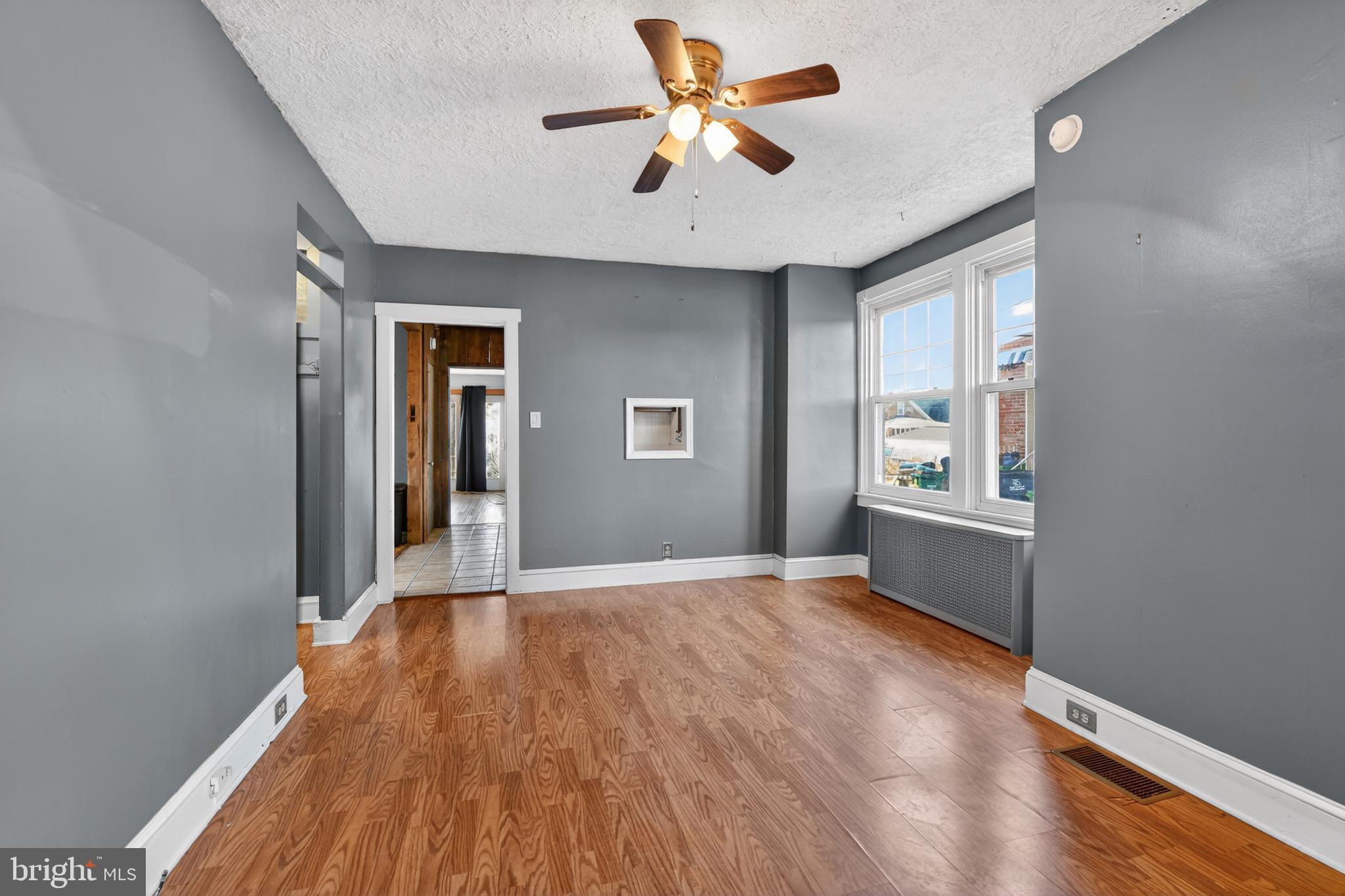 1378 Kenhorst Boulevard Reading, PA 19607 - Photo 7 of 29 wooden floor in an empty room with a window