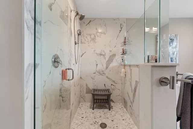 a spacious bathroom with a sink and a mirror