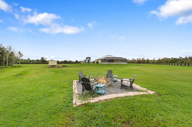 a view of a house with a big yard