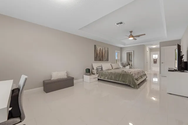 a bedroom with a bed and a chair