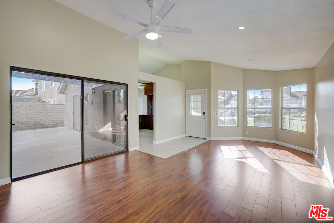 214 South Raspberry Lane Anaheim, CA 92808 - Photo 14 of 35 a view of an empty room with glass door and a window