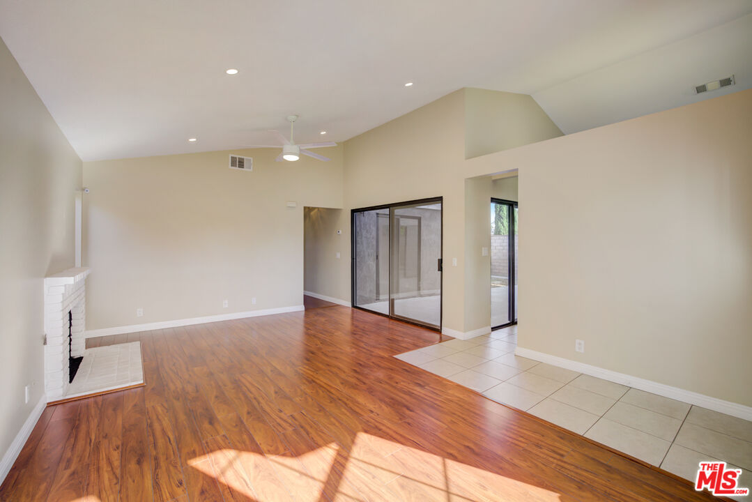 214 South Raspberry Lane Anaheim, CA 92808 - Photo 15 of 35 a view of an empty room with wooden floor