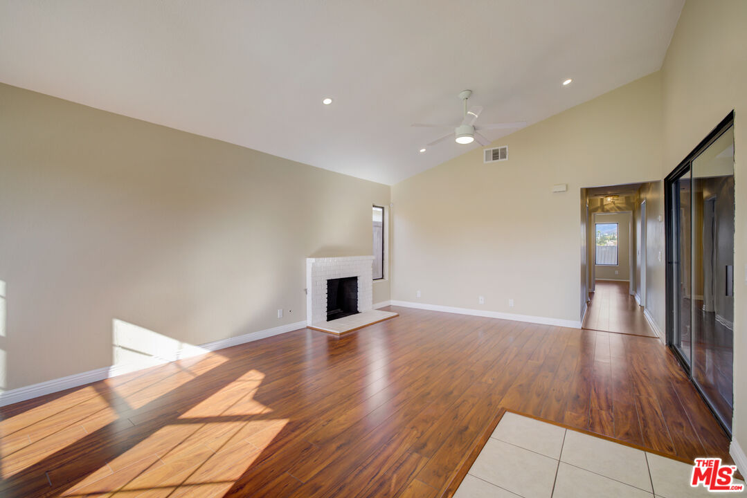 214 South Raspberry Lane Anaheim, CA 92808 - Photo 16 of 35 a view of empty room with wooden floor
