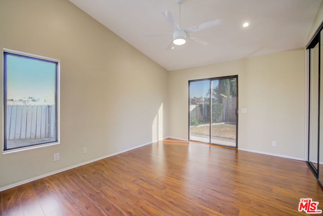 214 South Raspberry Lane Anaheim, CA 92808 - Photo 22 of 35 a view of an empty room with wooden floor