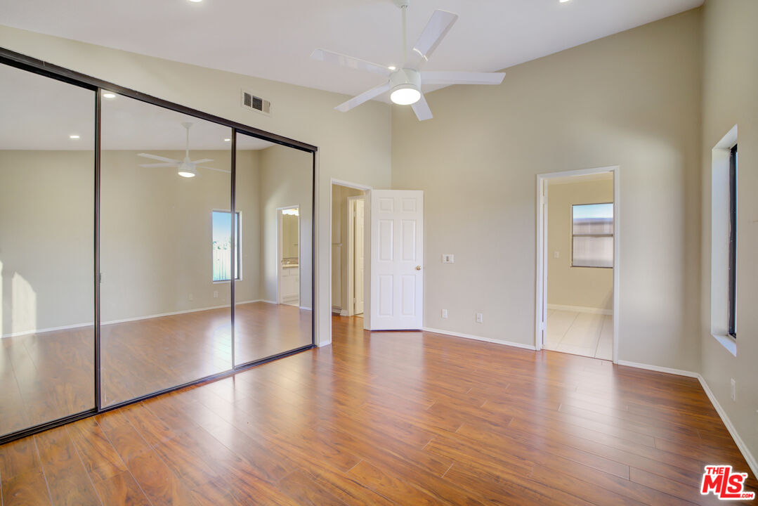 214 South Raspberry Lane Anaheim, CA 92808 - Photo 23 of 35 a view of an empty room with wooden floor and a window