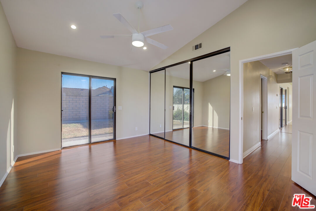 214 South Raspberry Lane Anaheim, CA 92808 - Photo 24 of 35 a view of an empty room with wooden floor and a bathroom