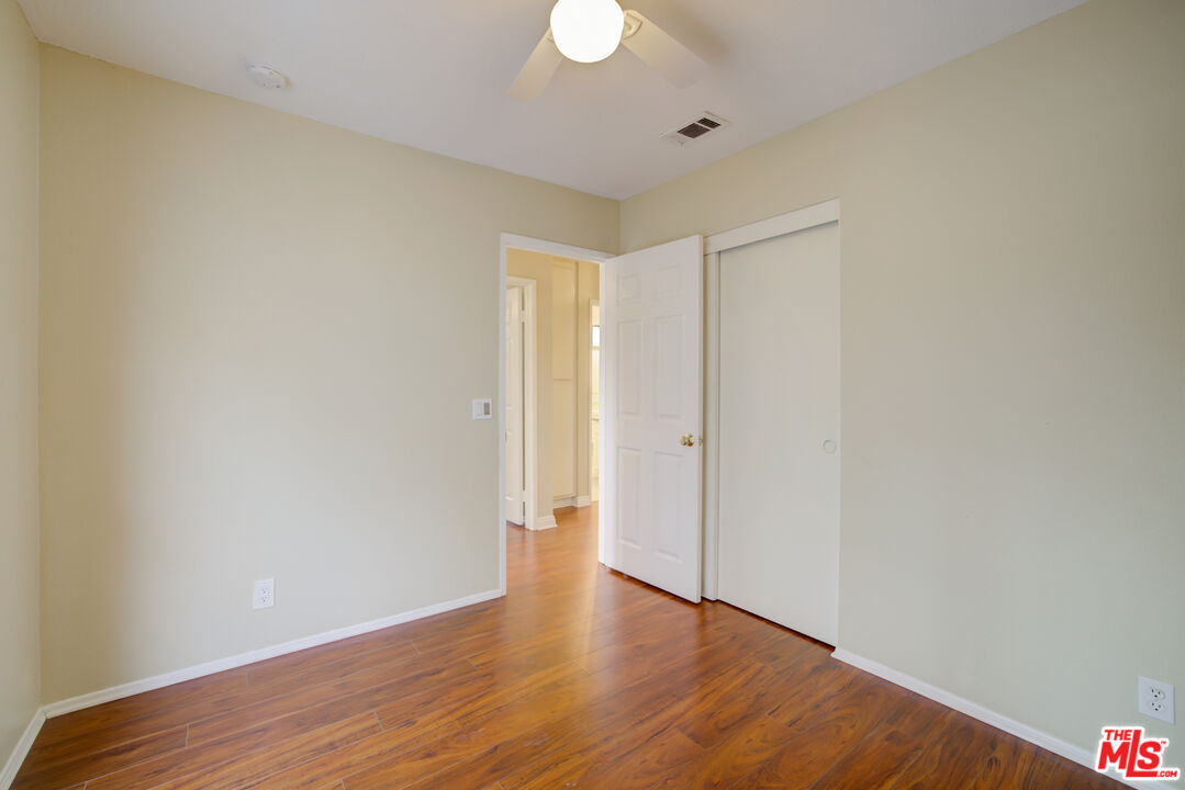 214 South Raspberry Lane Anaheim, CA 92808 - Photo 27 of 35 a view of an empty room with wooden floor