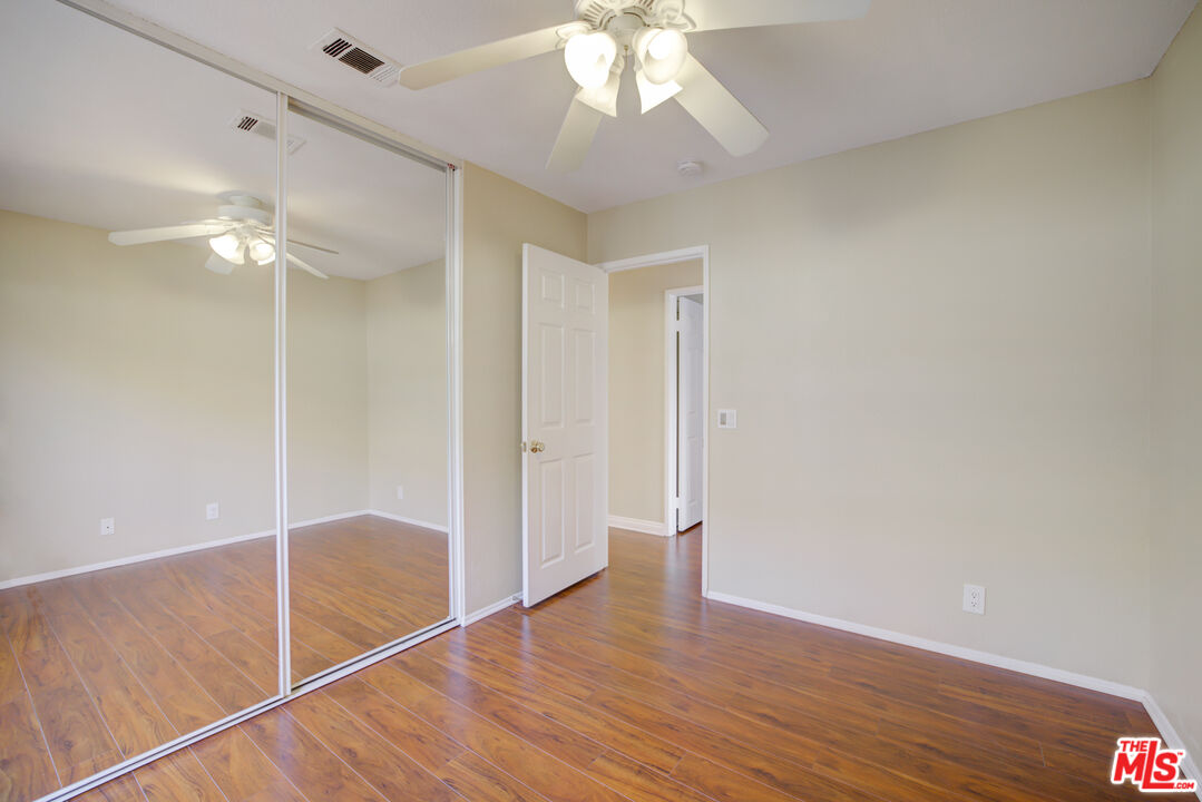 214 South Raspberry Lane Anaheim, CA 92808 - Photo 31 of 35 wooden floor in an empty room with a window