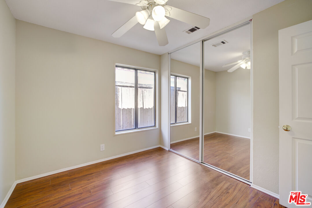 214 South Raspberry Lane Anaheim, CA 92808 - Photo 32 of 35 wooden floor in an empty room with a window