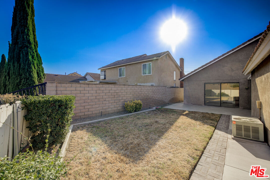 214 South Raspberry Lane Anaheim, CA 92808 - Photo 8 of 35 a front view of a house with garden