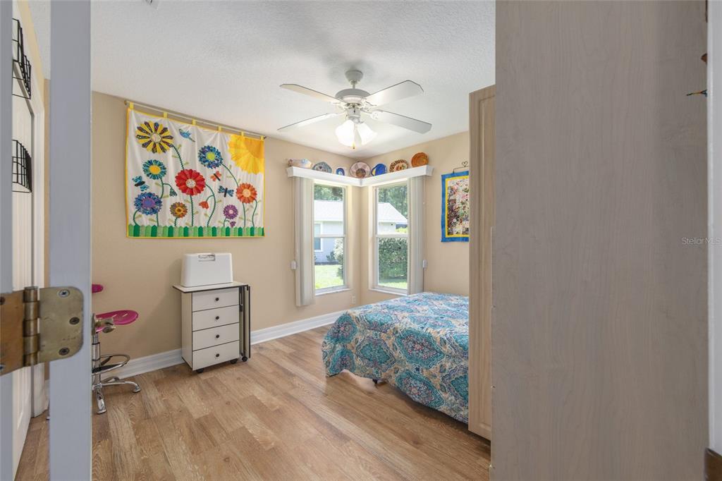18825 Southwest 93rd Loop Dunnellon, FL 34432 - Photo 32 of 85 a bedroom with a bed and a window