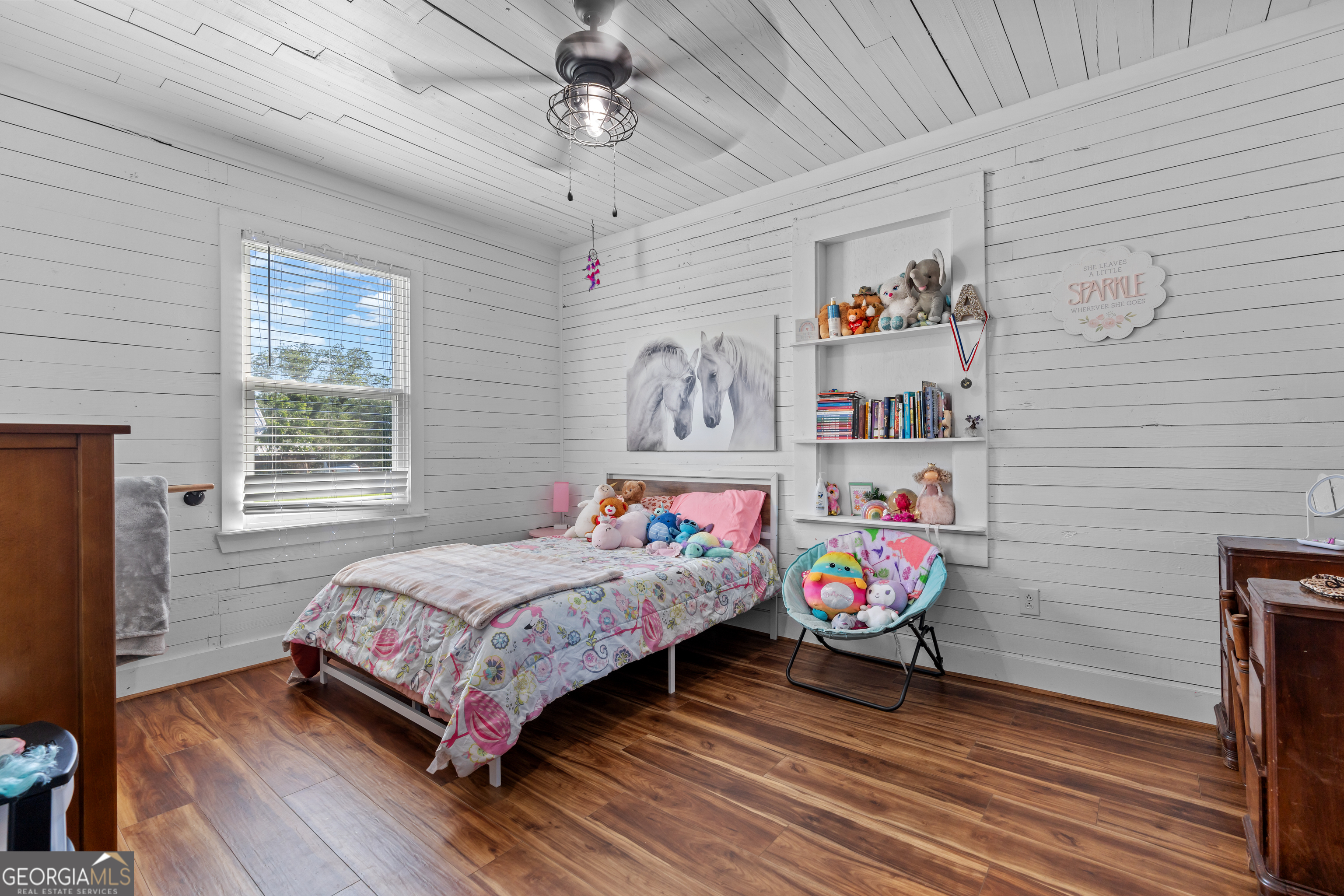 5065 10 Mile Road Baxley, GA 31513 - Photo 19 of 70 a bedroom with a bed and a chandelier