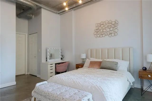 a bedroom with a bed and a table in it